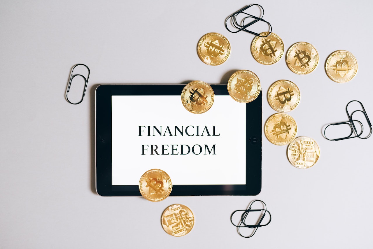 Financial freedom writting and coins around it